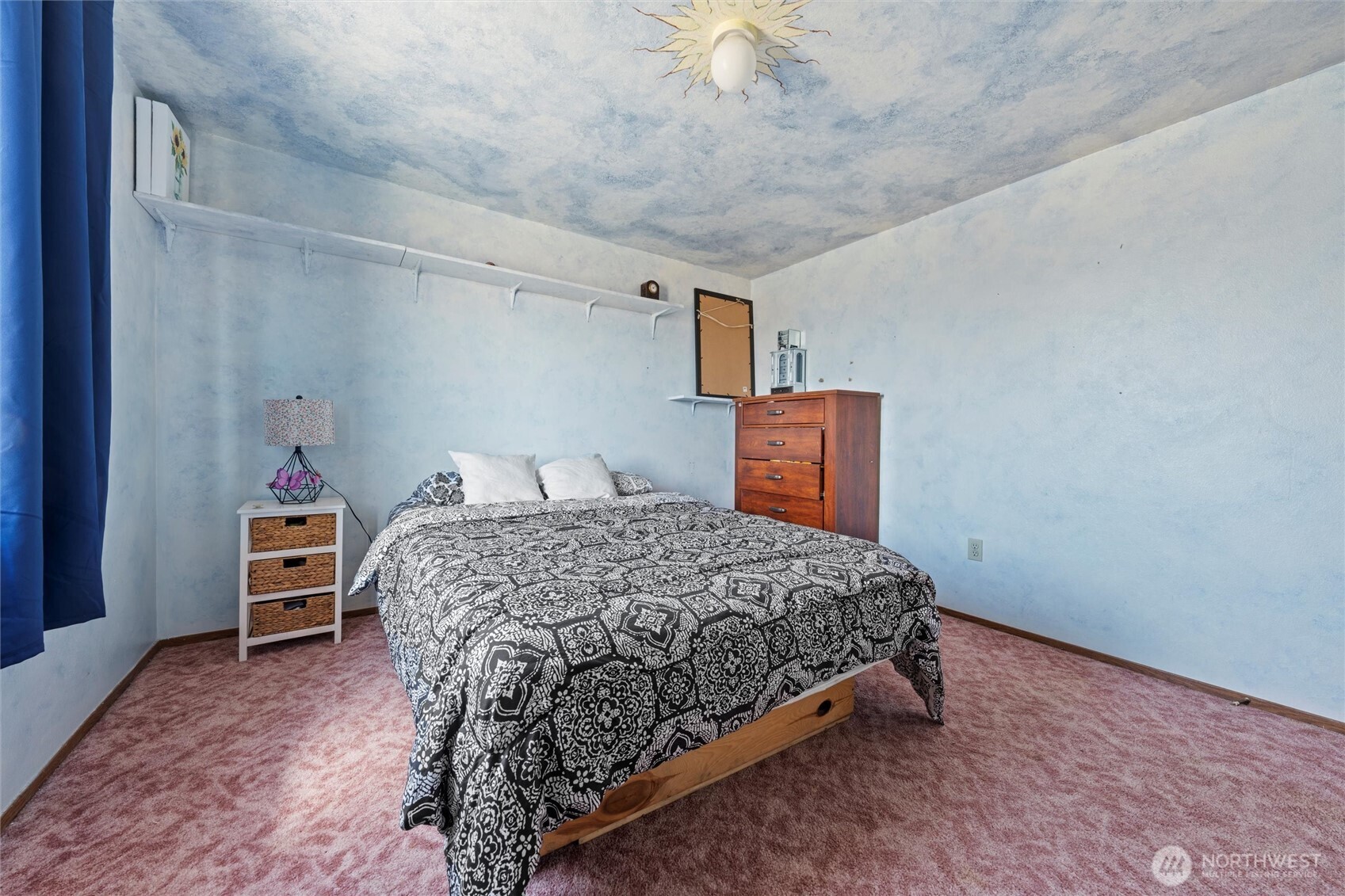 411 North Wahl Road Lind, WA 99341 - Photo 17 of 31 a bedroom with a bed and a cabinets