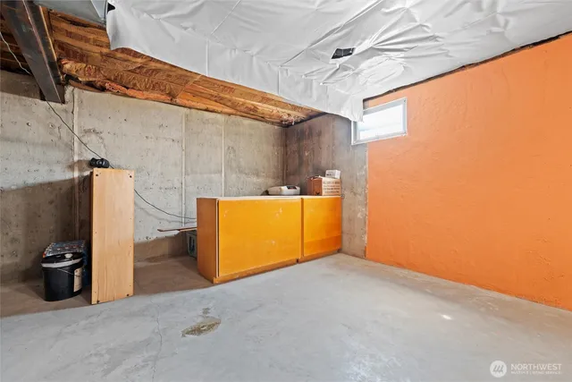 a view of an empty room with a chandelier