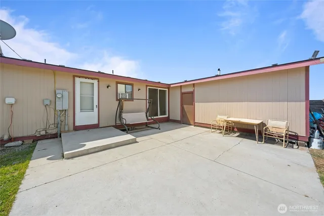a house view with a sitting space garden
