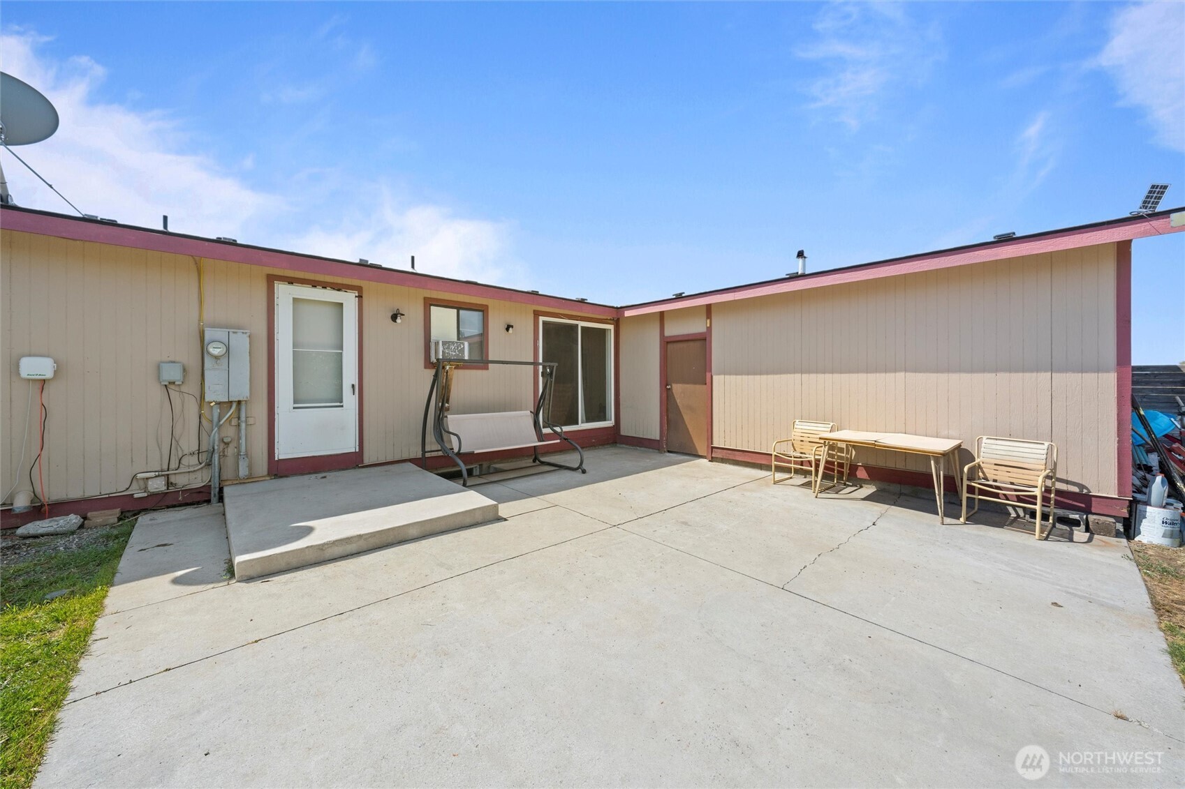 411 North Wahl Road Lind, WA 99341 - Photo 30 of 31 a view of a patio with table and chairs and couches with wooden floor