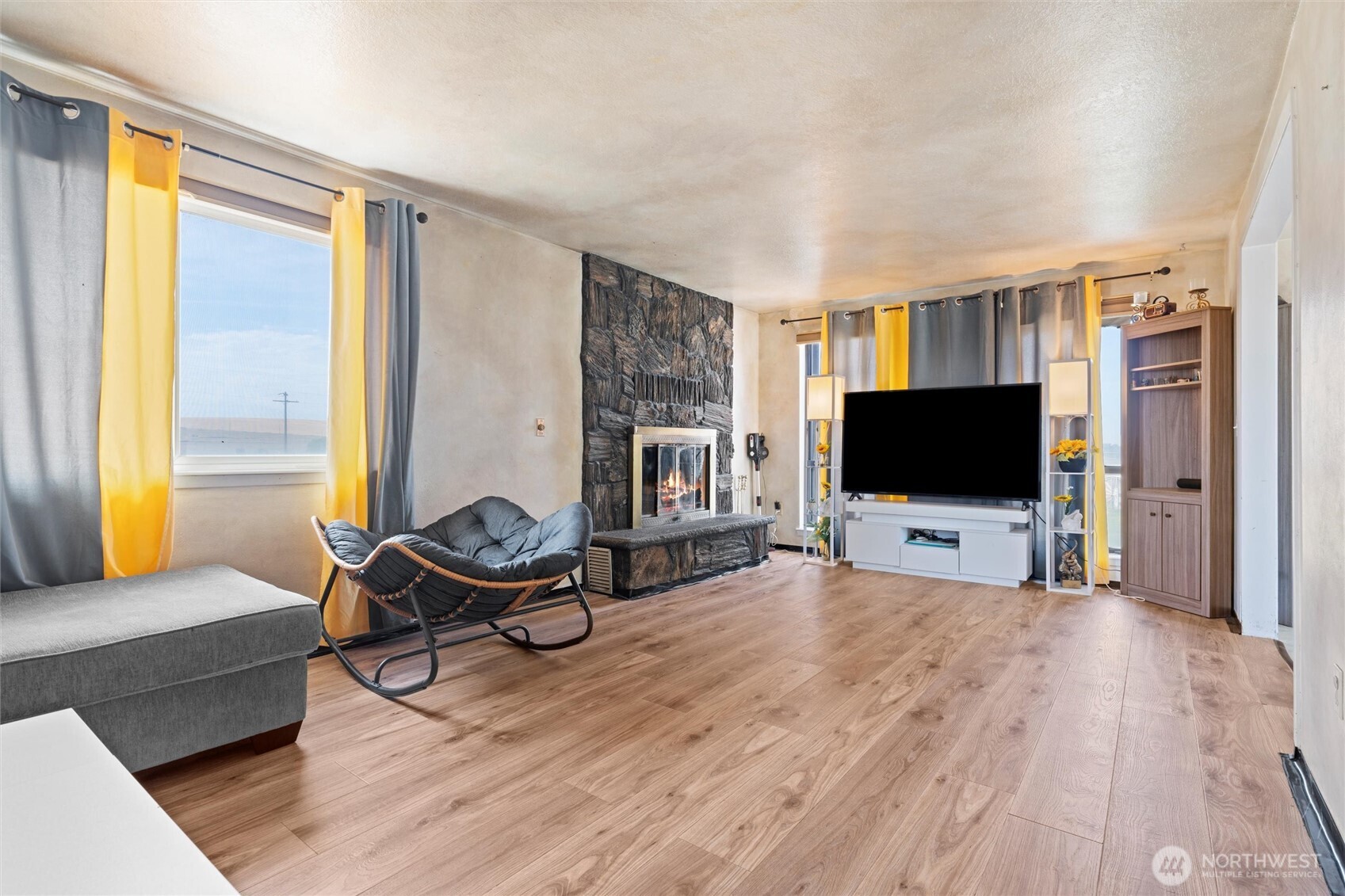 411 North Wahl Road Lind, WA 99341 - Photo 8 of 31 a living room with furniture and a flat screen tv