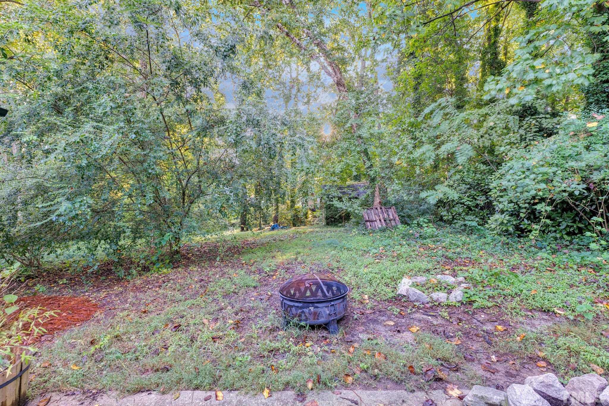 3422 Baugh Street Raleigh, NC 27604 - Photo 4 of 28 a view of a backyard with large trees