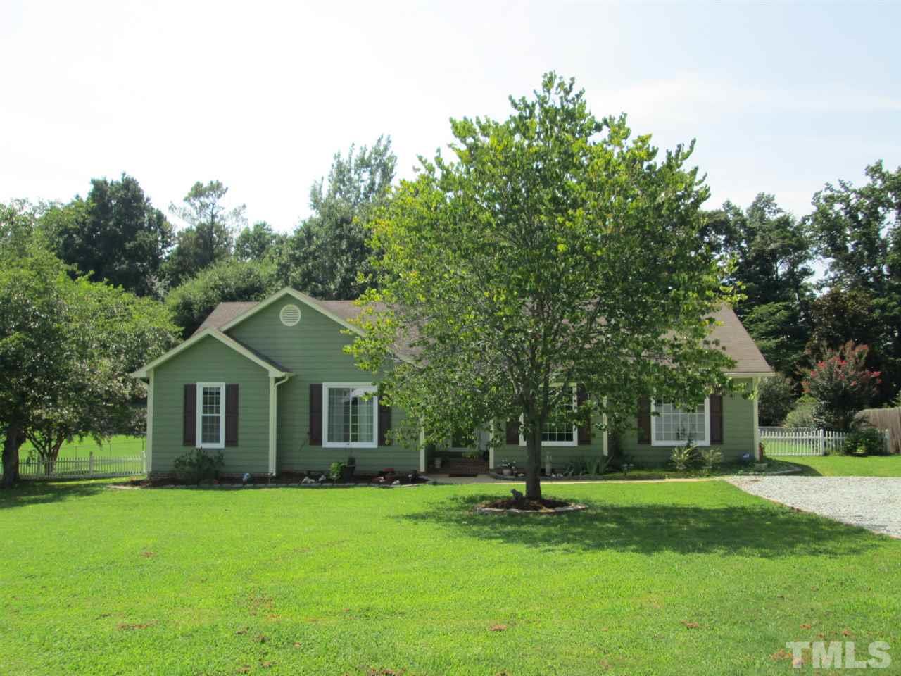 7001 Kiger Road Rougemont, NC 27572 - Photo 1 of 25 a front view of a house with a garden