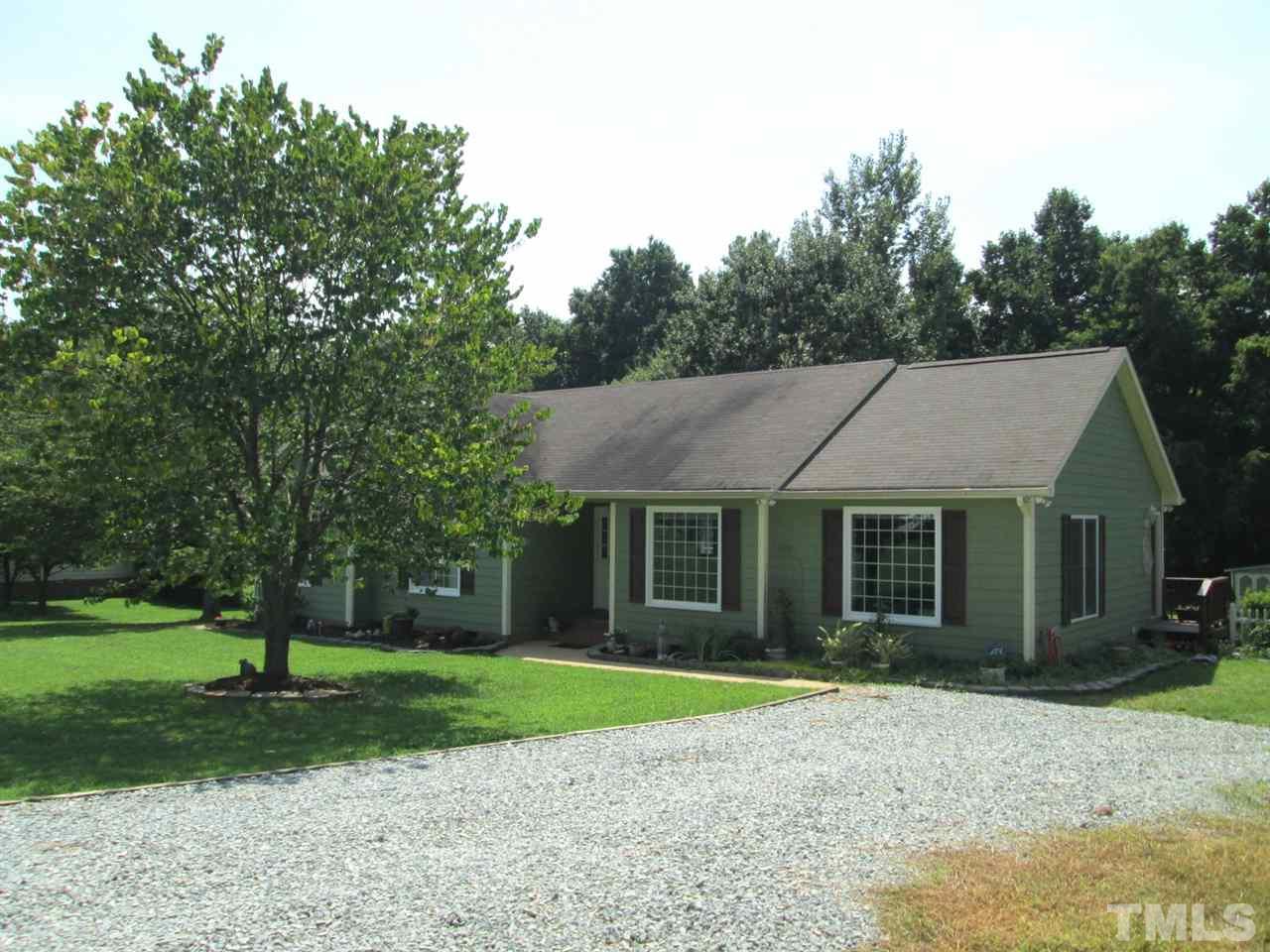 7001 Kiger Road Rougemont, NC 27572 - Photo 2 of 25 a view of a house with yard and tree s