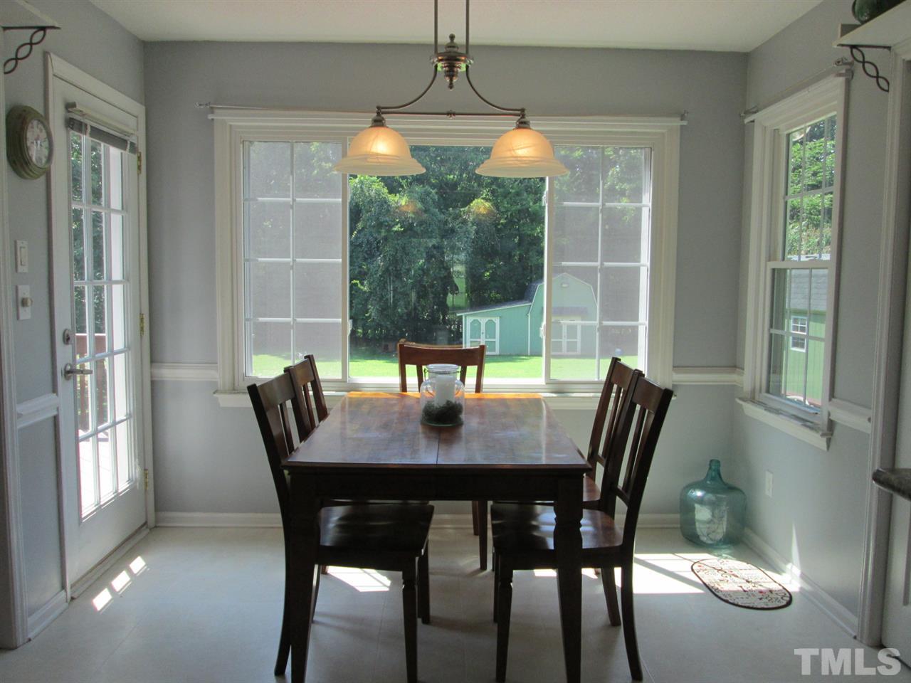 7001 Kiger Road Rougemont, NC 27572 - Photo 11 of 25 a view of a dining room with furniture window and outside view