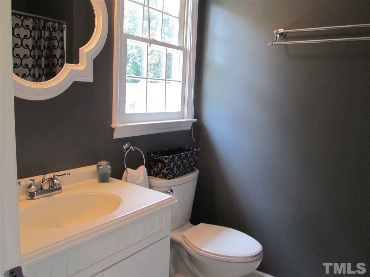7001 Kiger Road Rougemont, NC 27572 - Photo 14 of 25 a bathroom with a sink and a toilet