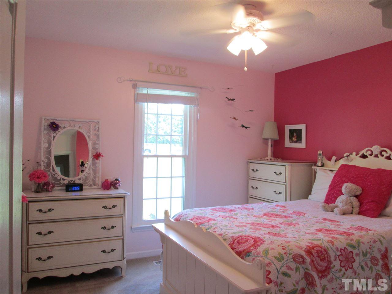 7001 Kiger Road Rougemont, NC 27572 - Photo 15 of 25 a bedroom with a bed and a dresser