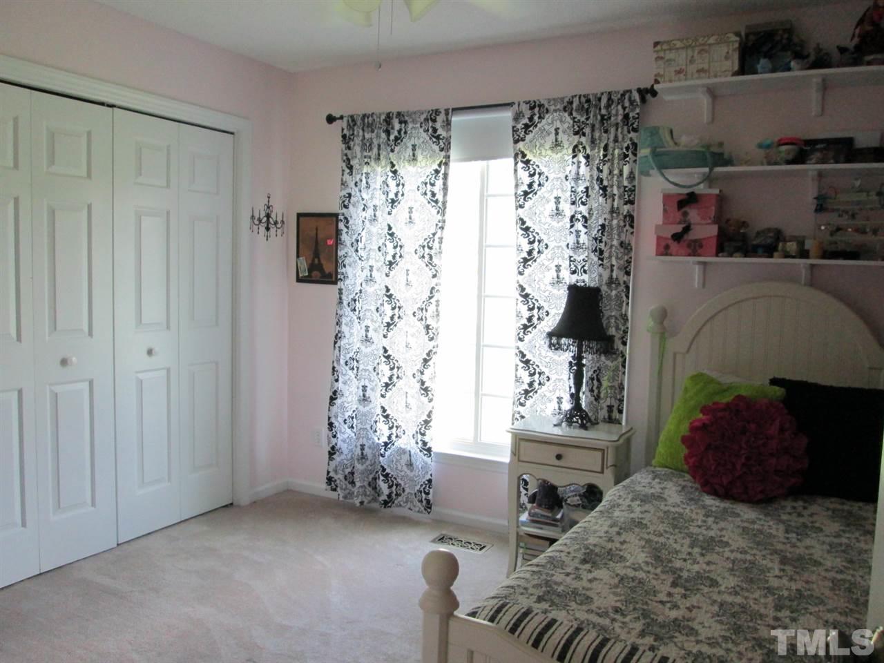 7001 Kiger Road Rougemont, NC 27572 - Photo 16 of 25 a bedroom with bed and a window