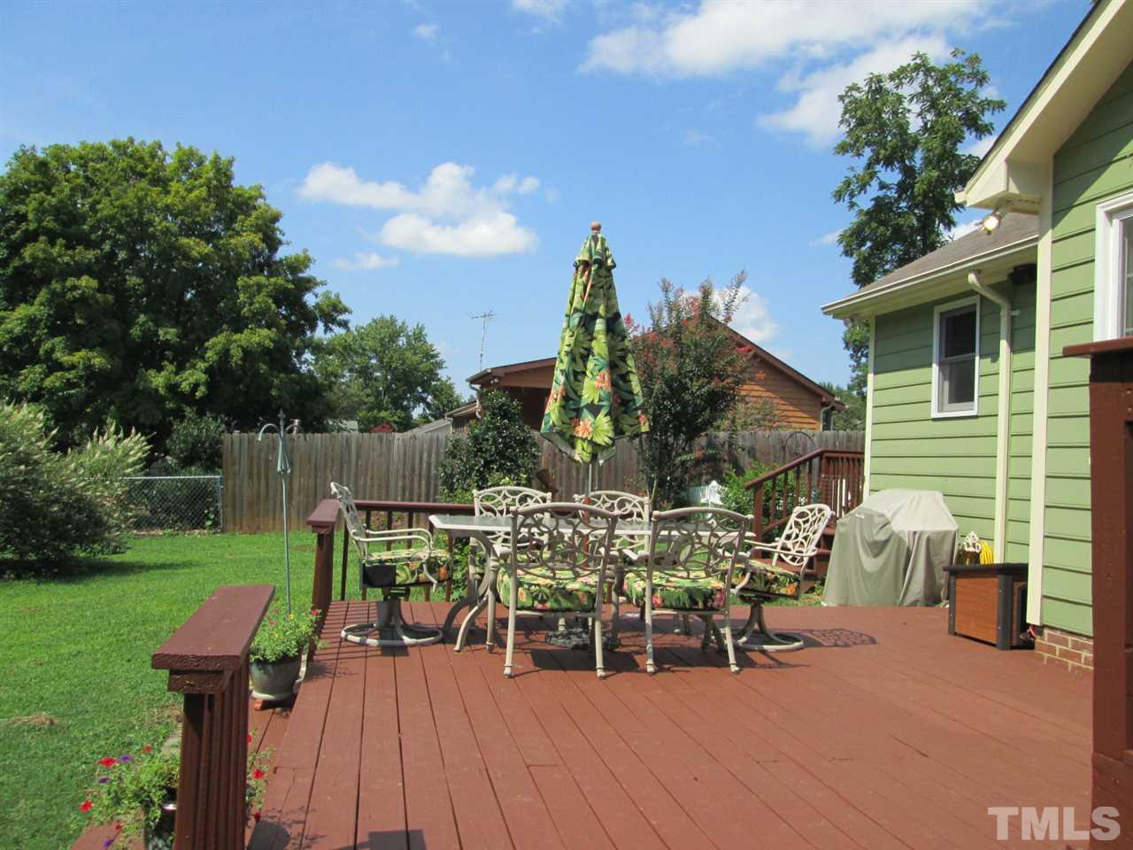 7001 Kiger Road Rougemont, NC 27572 - Photo 18 of 25 a view of a chairs and table in backyard of the house