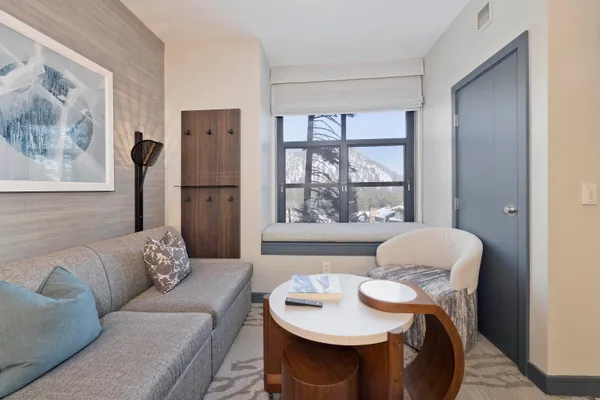 a living room with furniture and a large window