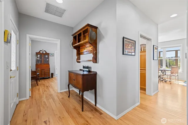 a view of a livingroom with furniture and wooden floor