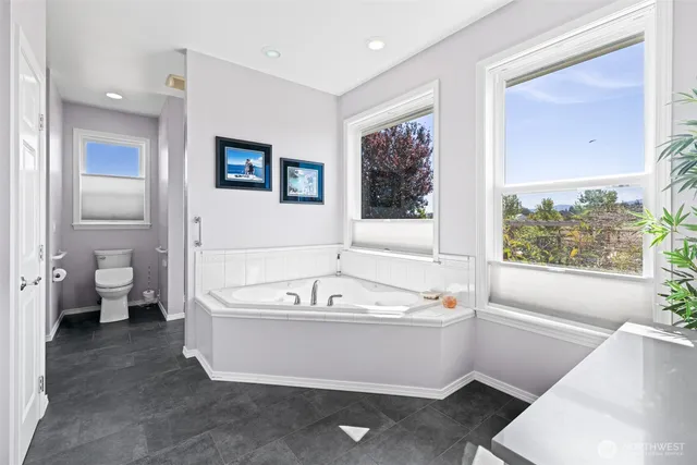 a view of a livingroom kitchen and dinning room with wooden floor