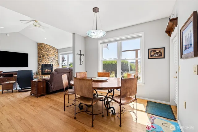 a view of a dining room with furniture window and wooden floor