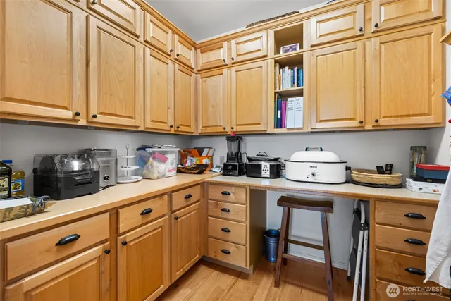 a kitchen with stainless steel appliances granite countertop a sink and cabinets