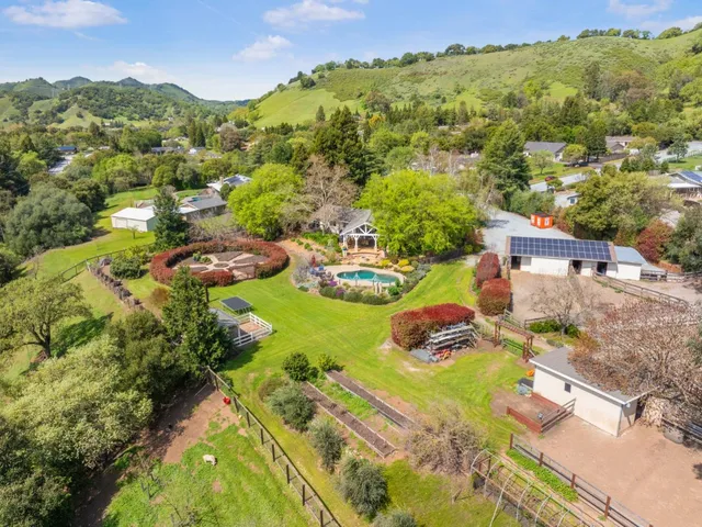 an aerial view of residential houses with outdoor space