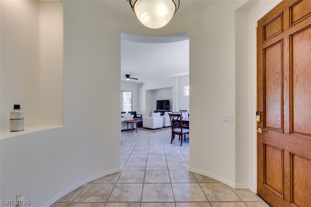 8 Kennesaw Road Henderson, NV 89052 - Photo 5 of 44 Enter into a welcoming foyer with tiled flooring leading to open concept living spaces.