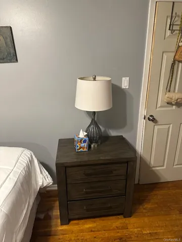 a bedroom with a bed and a desk