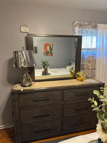 a bathroom with a sink vanity granite and a mirror