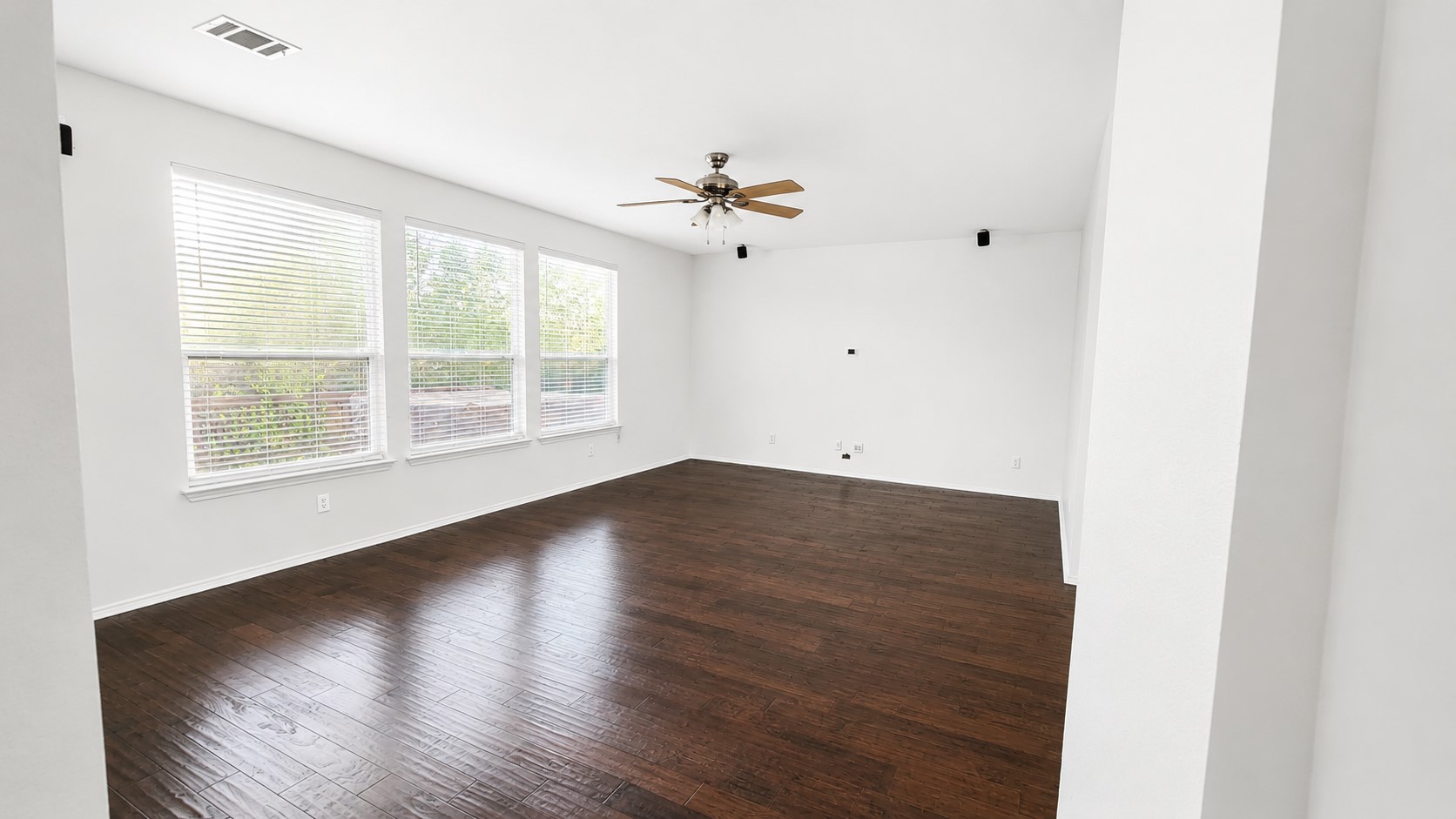 10528 Dunham Forest Road Austin, TX 78717 - Photo 2 of 12 Rich hardwood floors complement abundant natural illumination in this inviting open space.