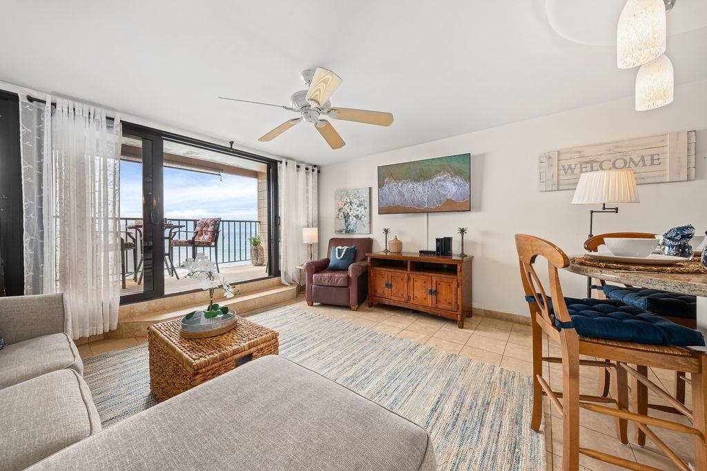 3785 Lower Honoapiilani Road, Unit 208 Lahaina, HI 96761 - Photo 17 of 50 a living room with furniture and a window