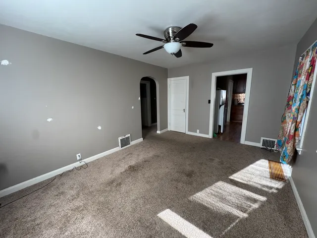 a view of a livingroom with a ceiling fan