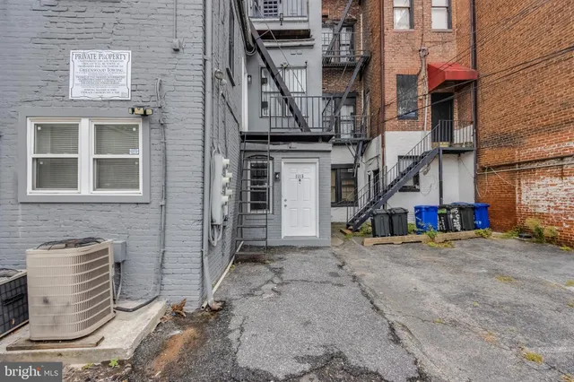 a view of a street with sitting area