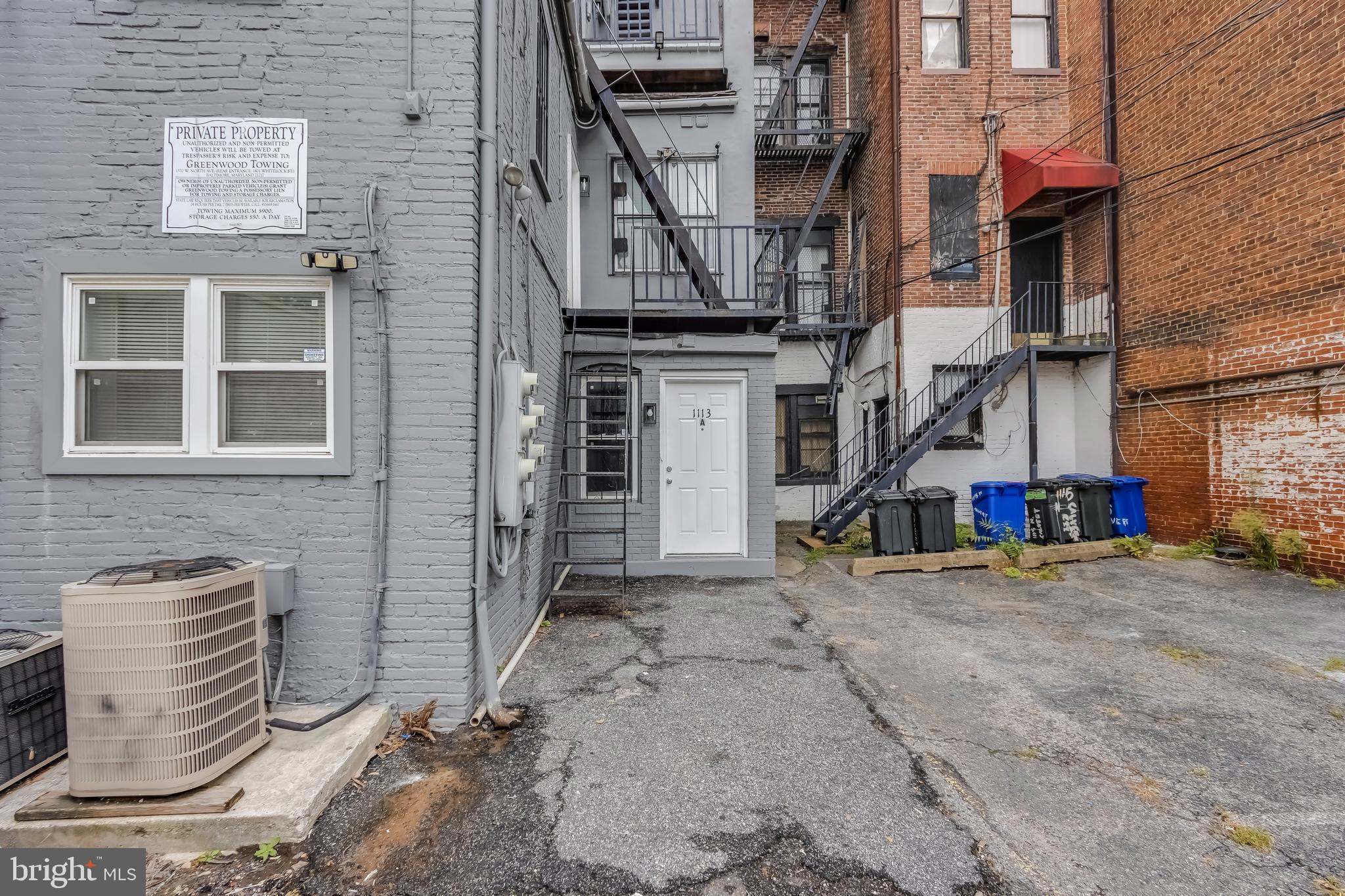1113 North Calvert Street, Unit B Baltimore, MD 21202 - Photo 6 of 6 a view of a street with sitting area