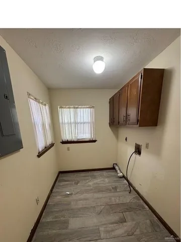 a room with gym equipment and windows