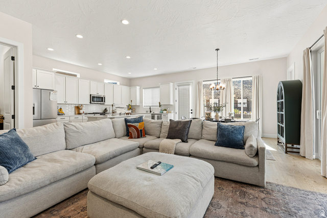 839 Walker Way St. George, UT 84770 - Photo 7 of 32 Open-concept living space featuring a spacious layout, recessed lighting, and wood-finish flooring