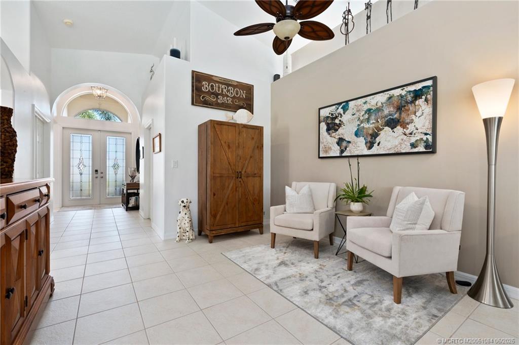 2688 Southeast Castle Pine Place Stuart, FL 34997 - Photo 13 of 49 a living room with furniture and a flat screen tv