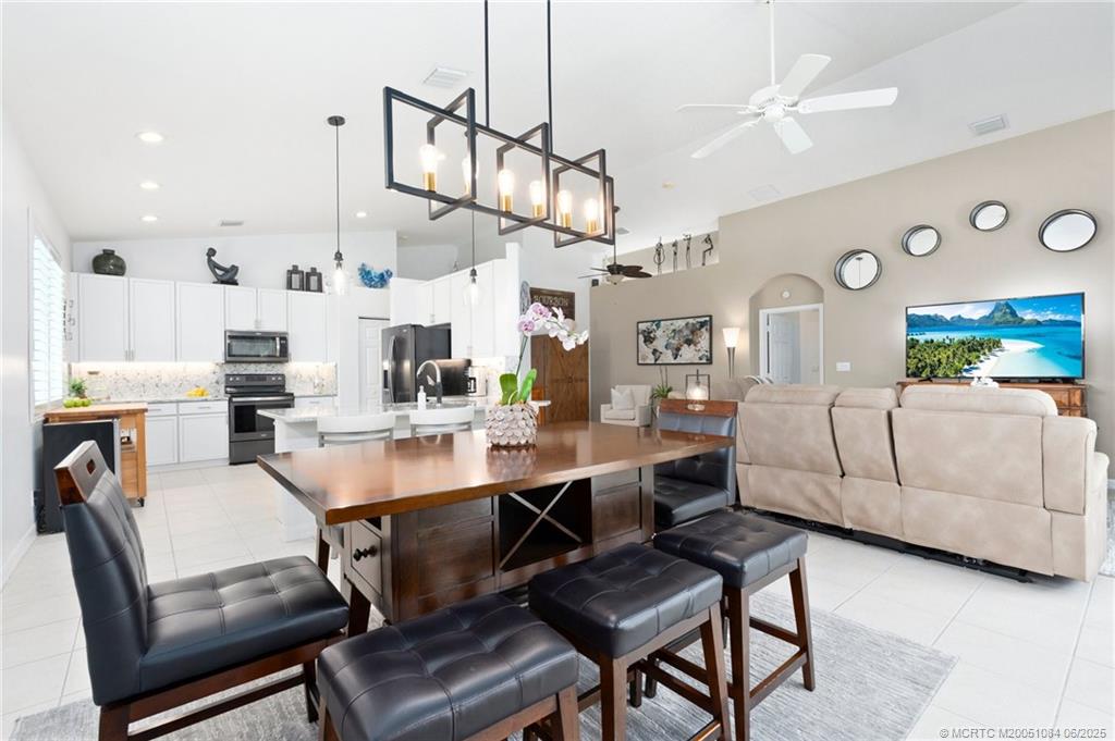 2688 Southeast Castle Pine Place Stuart, FL 34997 - Photo 18 of 49 a view of a dining room with furniture