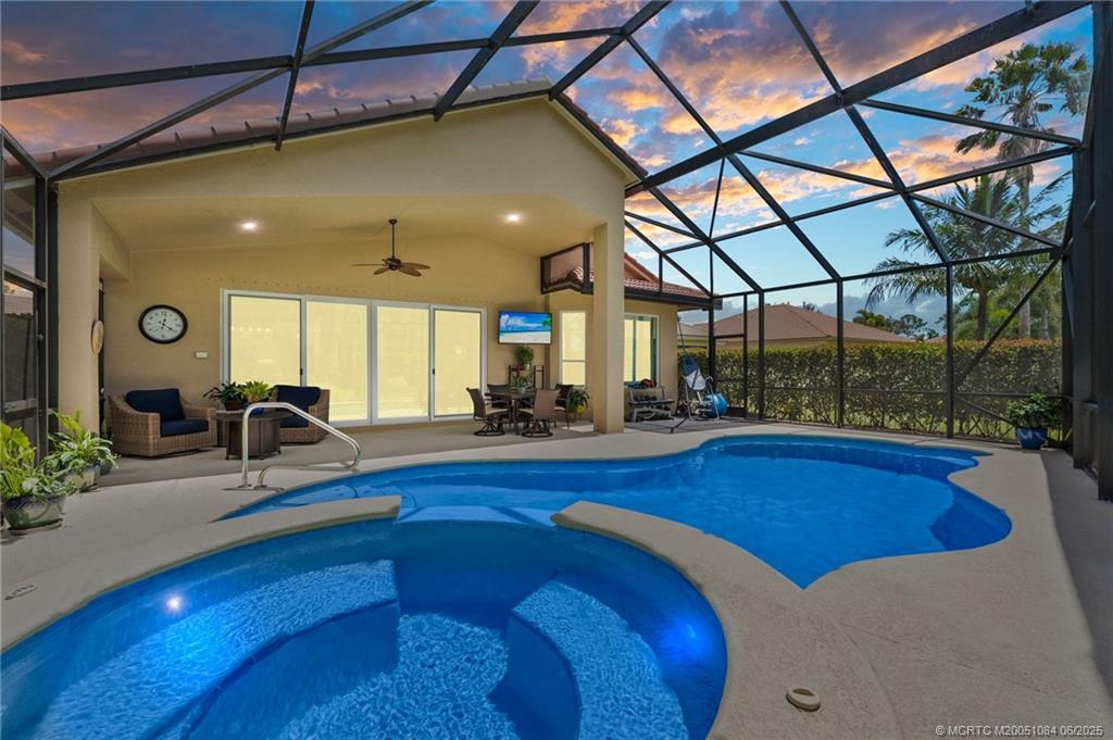 2688 Southeast Castle Pine Place Stuart, FL 34997 - Photo 2 of 49 a room with pool table and glass windows