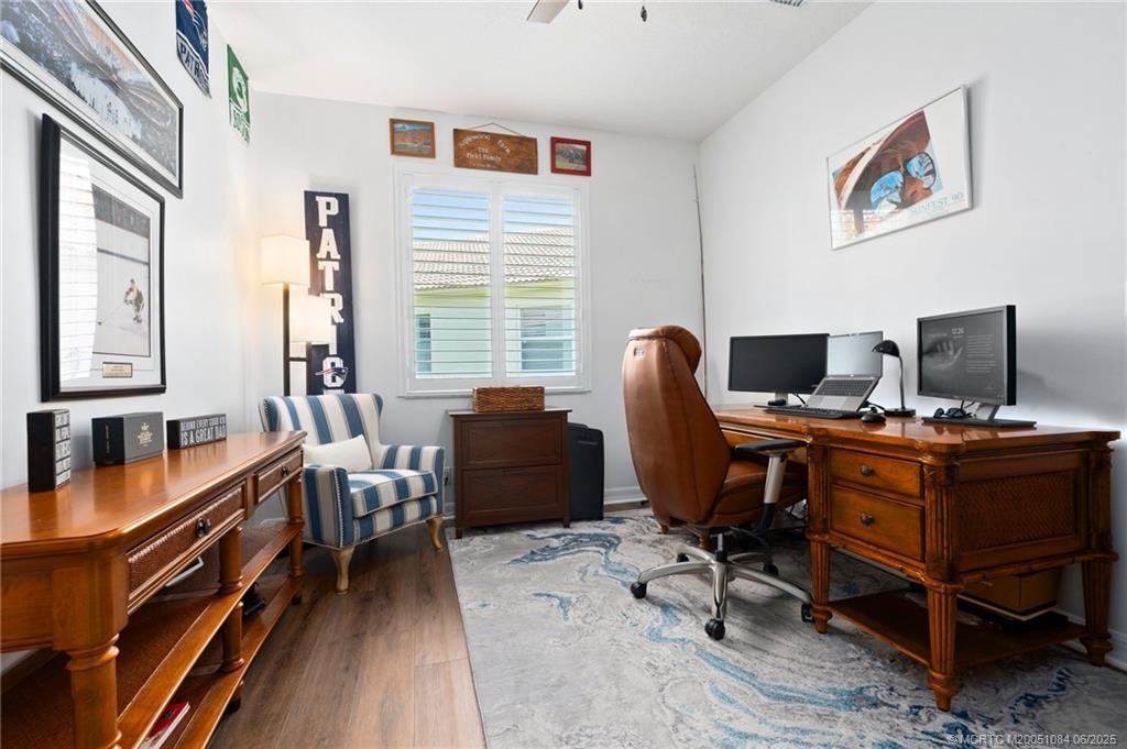 2688 Southeast Castle Pine Place Stuart, FL 34997 - Photo 22 of 49 a view of a workspace with furniture and a window