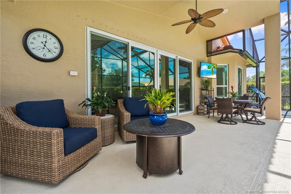 2688 Southeast Castle Pine Place Stuart, FL 34997 - Photo 32 of 49 a living room with furniture and a large window
