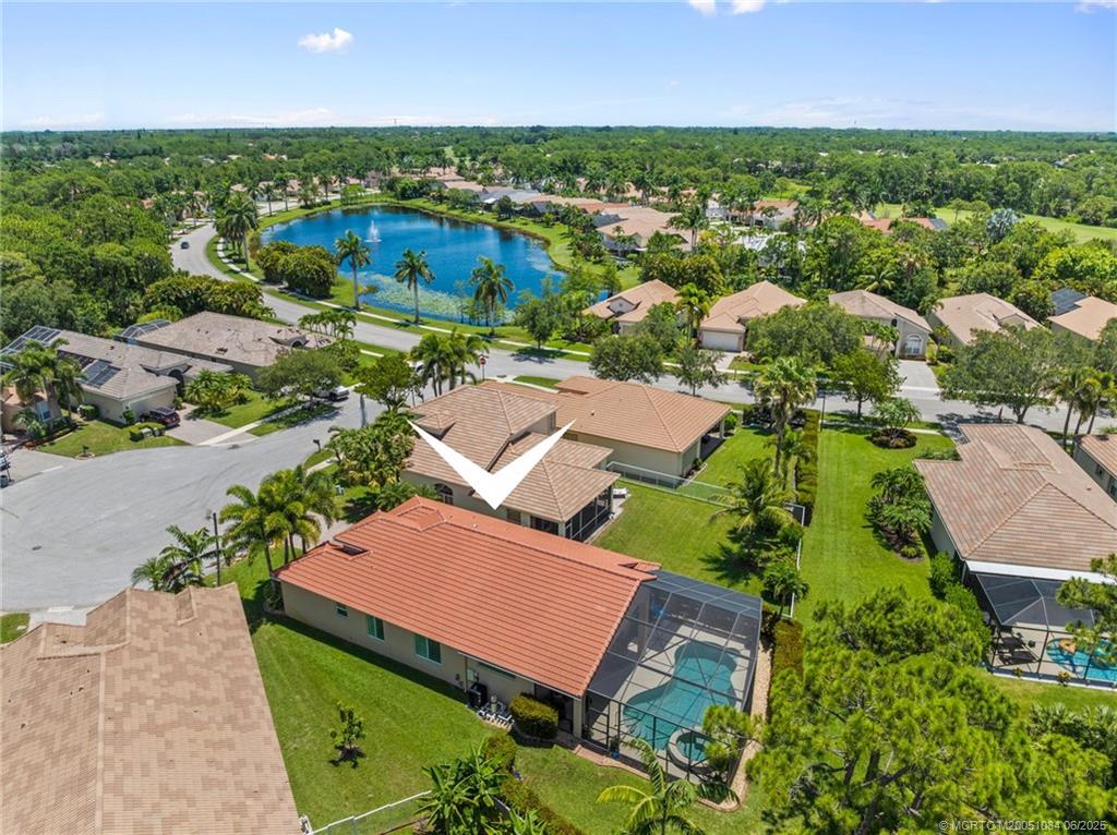 2688 Southeast Castle Pine Place Stuart, FL 34997 - Photo 39 of 49 an aerial view of residential houses with outdoor space and a lake view