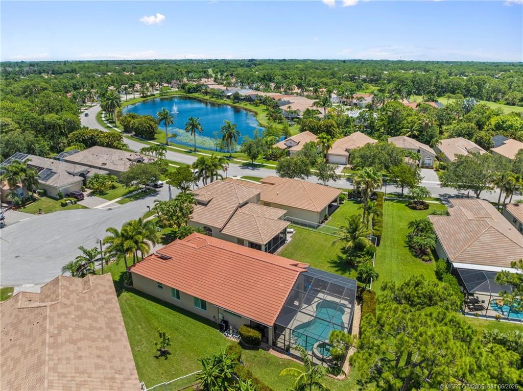 2688 Southeast Castle Pine Place Stuart, FL 34997 - Photo 40 of 49 an aerial view of residential houses with outdoor space and a lake view