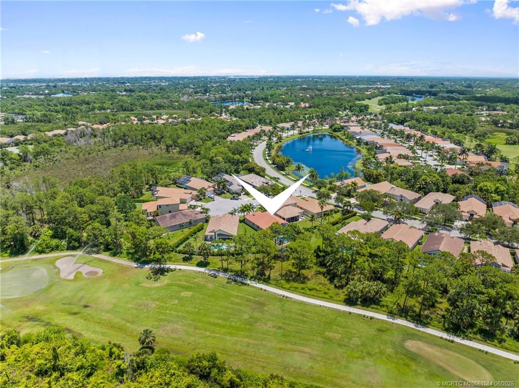 2688 Southeast Castle Pine Place Stuart, FL 34997 - Photo 45 of 49 a view of a lake with a houses