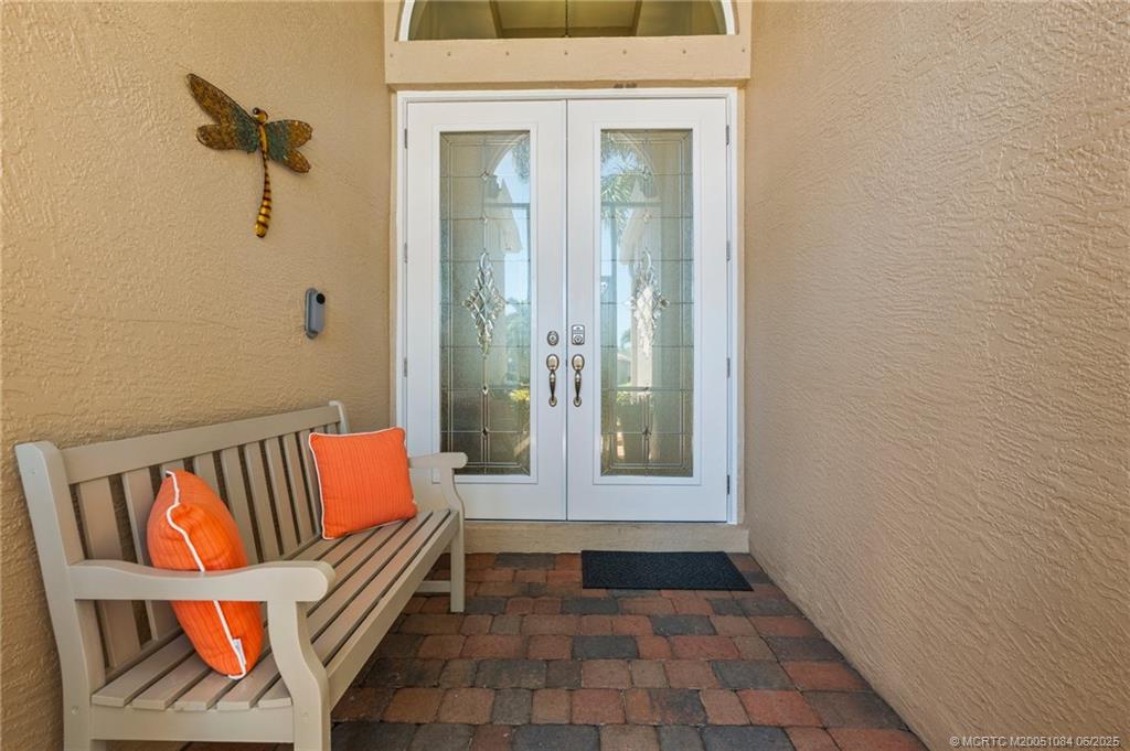 2688 Southeast Castle Pine Place Stuart, FL 34997 - Photo 8 of 49 a view of front door