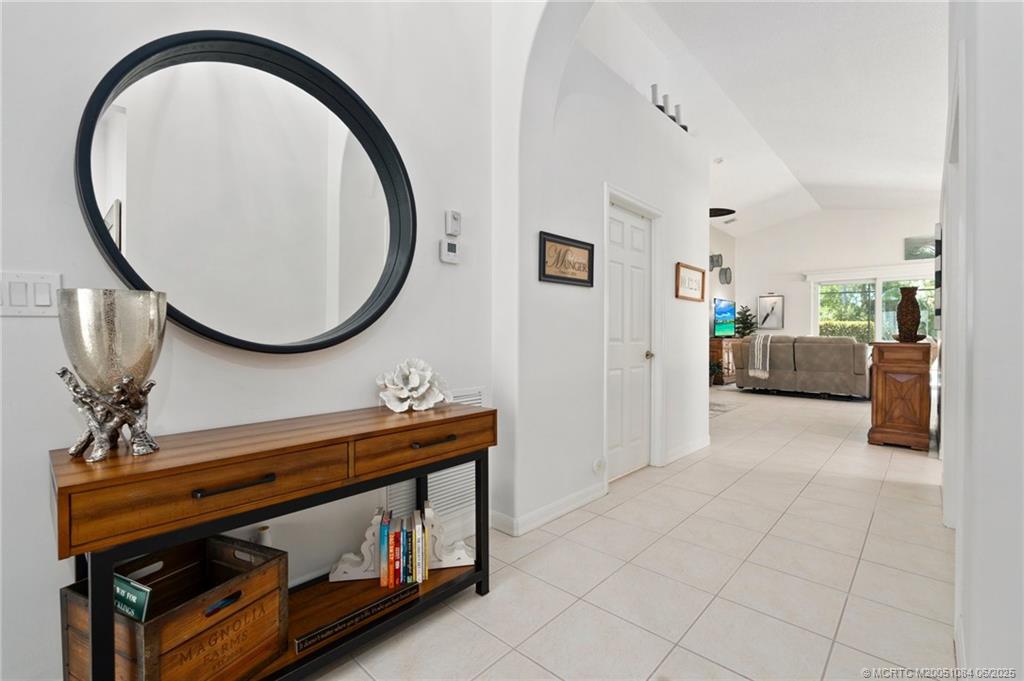 2688 Southeast Castle Pine Place Stuart, FL 34997 - Photo 10 of 49 a view of a livingroom with furniture and a mirror