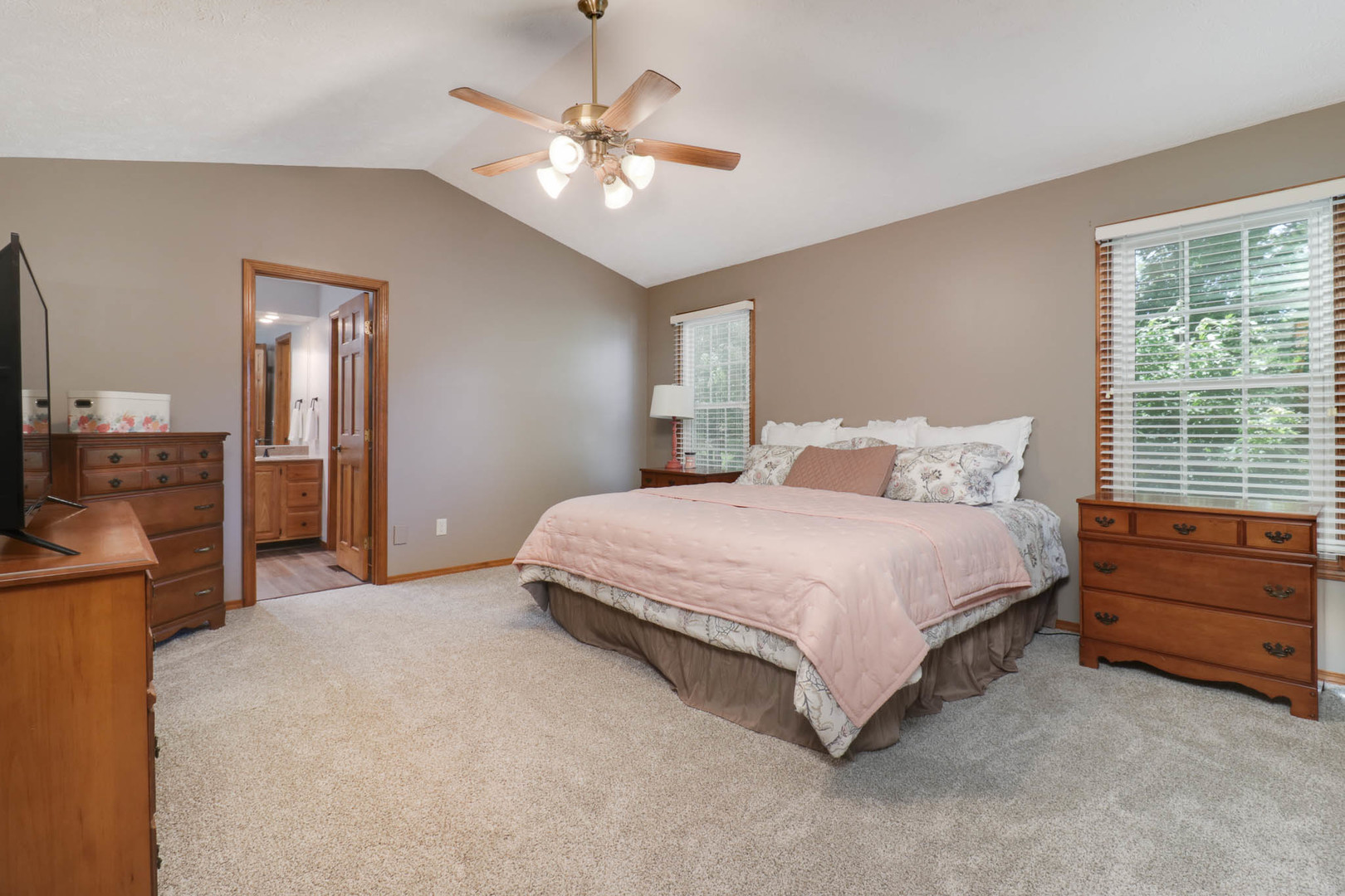 3203 Eagle Crest Road Bloomington, IL 61704 - Photo 19 of 52 a bedroom with a bed and a chandelier