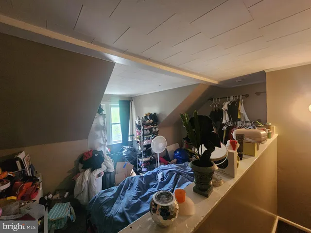 a living room with furniture and a closet