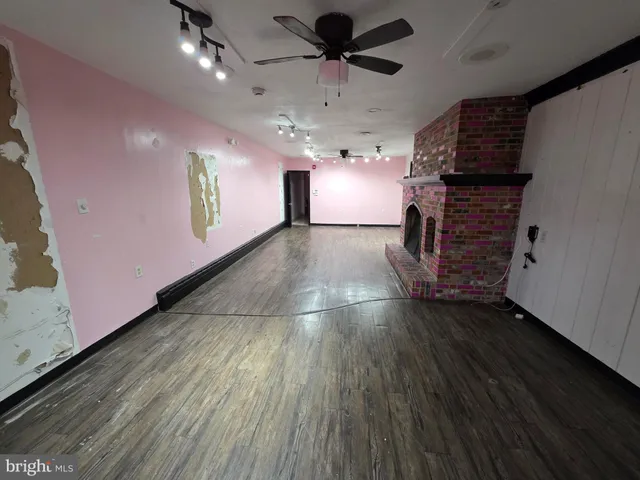 a hallway with wooden floor