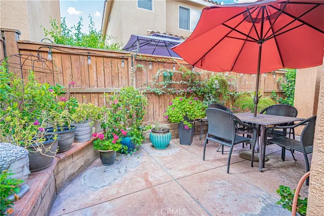 a kitchen with stainless steel appliances kitchen island granite countertop a sink and cabinets