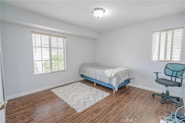 a bedroom with a bed and a lamp