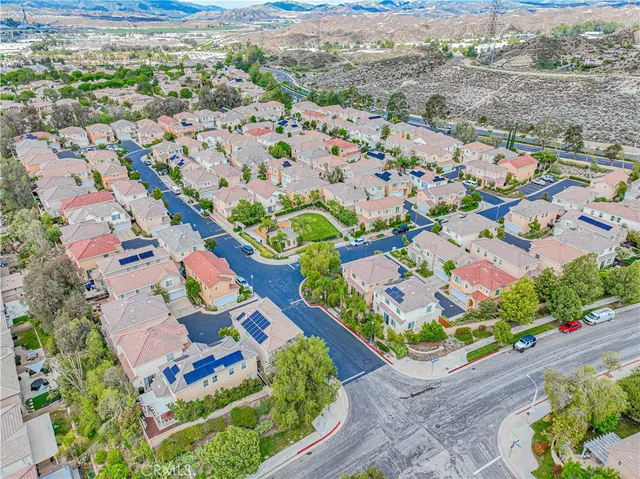 front view of a house with a tree