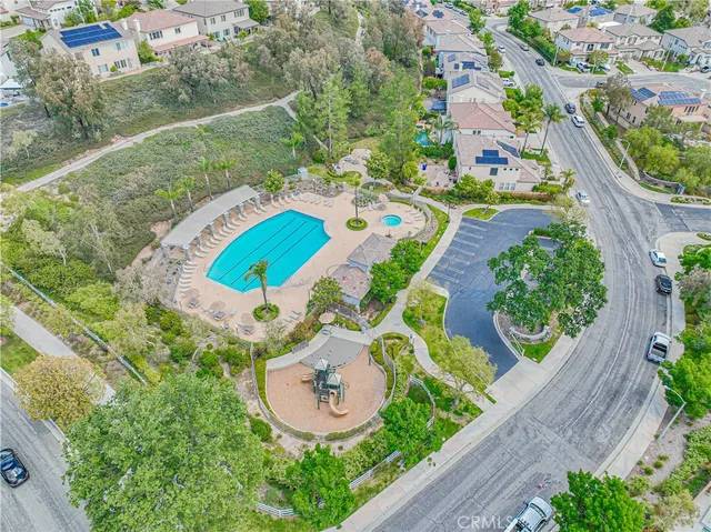 a view of a house with swimming pool and a porch