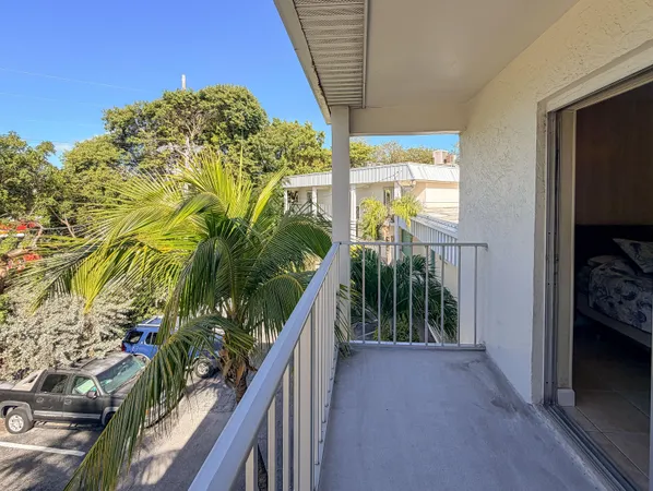 a view of balcony and yard