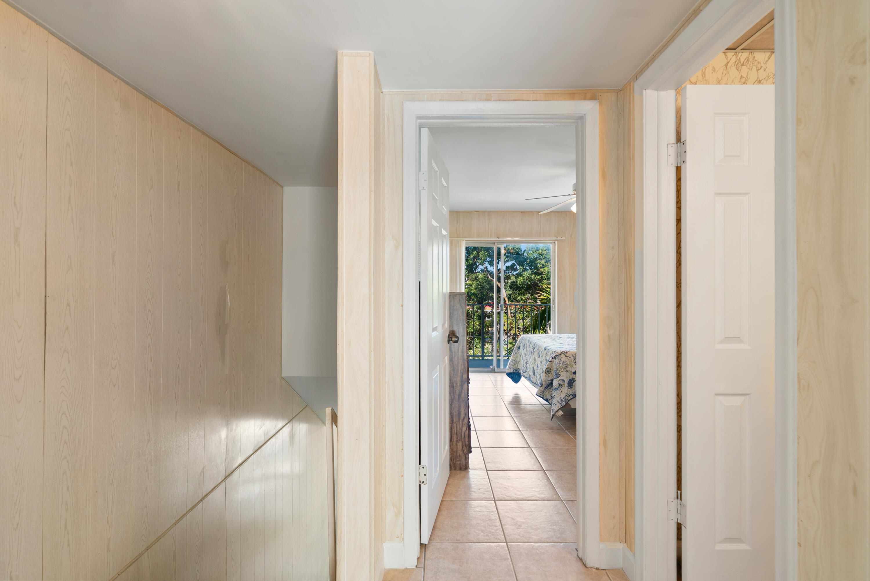 300 Ocean Drive, Unit 23 Key Largo, FL 33037 - Photo 18 of 29 a view of a hallway with white walls and furniture