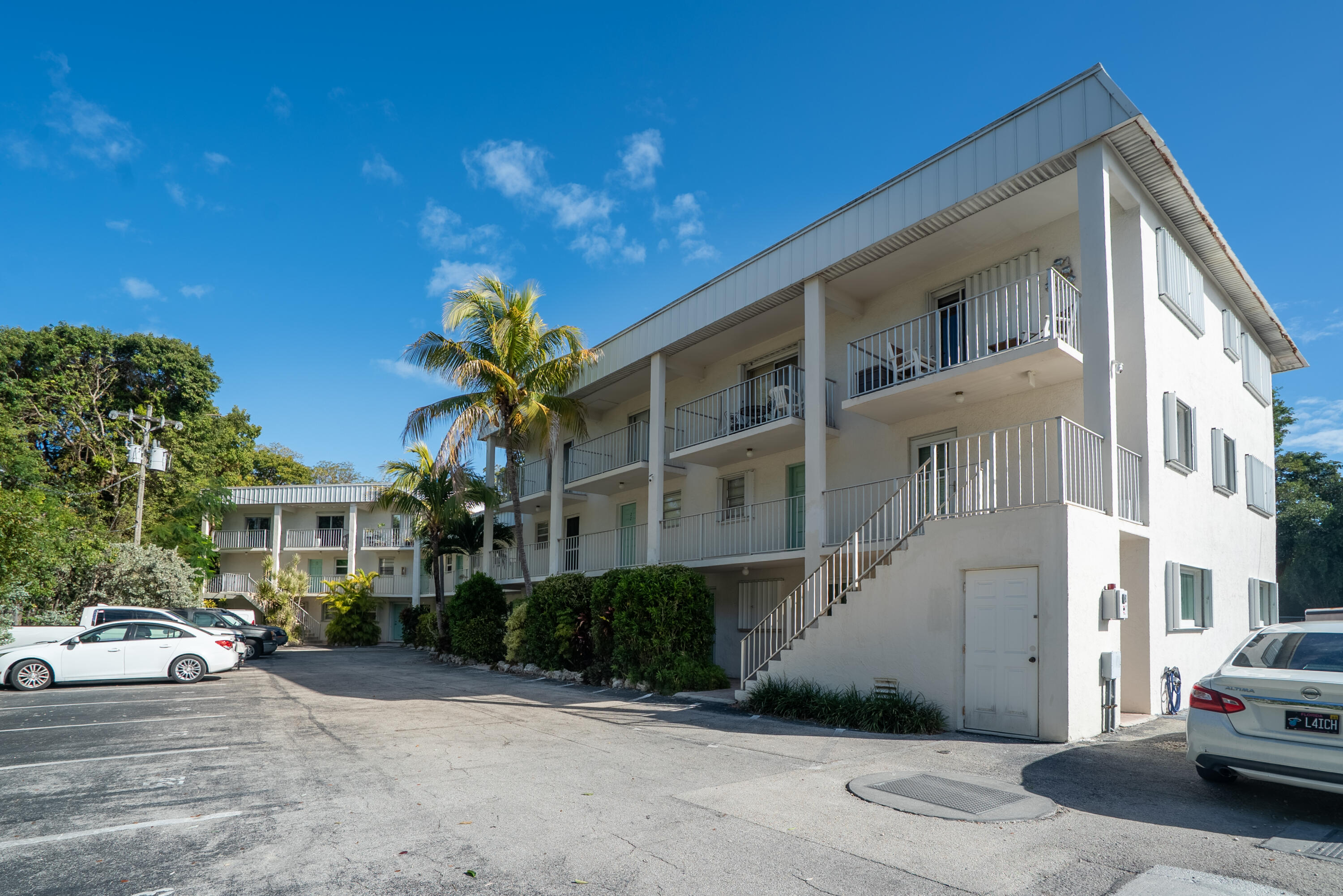300 Ocean Drive, Unit 23 Key Largo, FL 33037 - Photo 26 of 29 a view of a white apartments with large windows