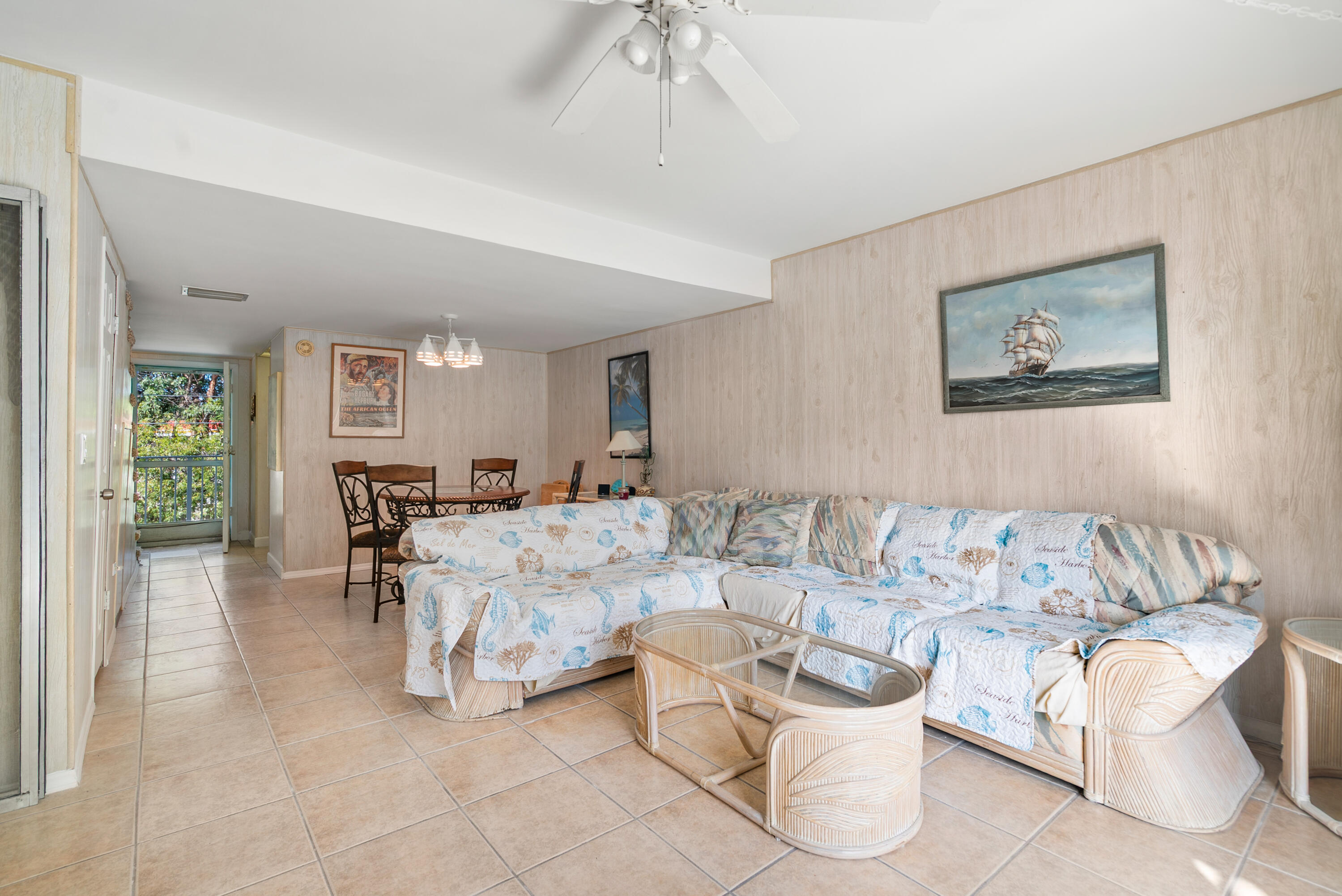 300 Ocean Drive, Unit 23 Key Largo, FL 33037 - Photo 5 of 29 a living room with furniture and a chandelier
